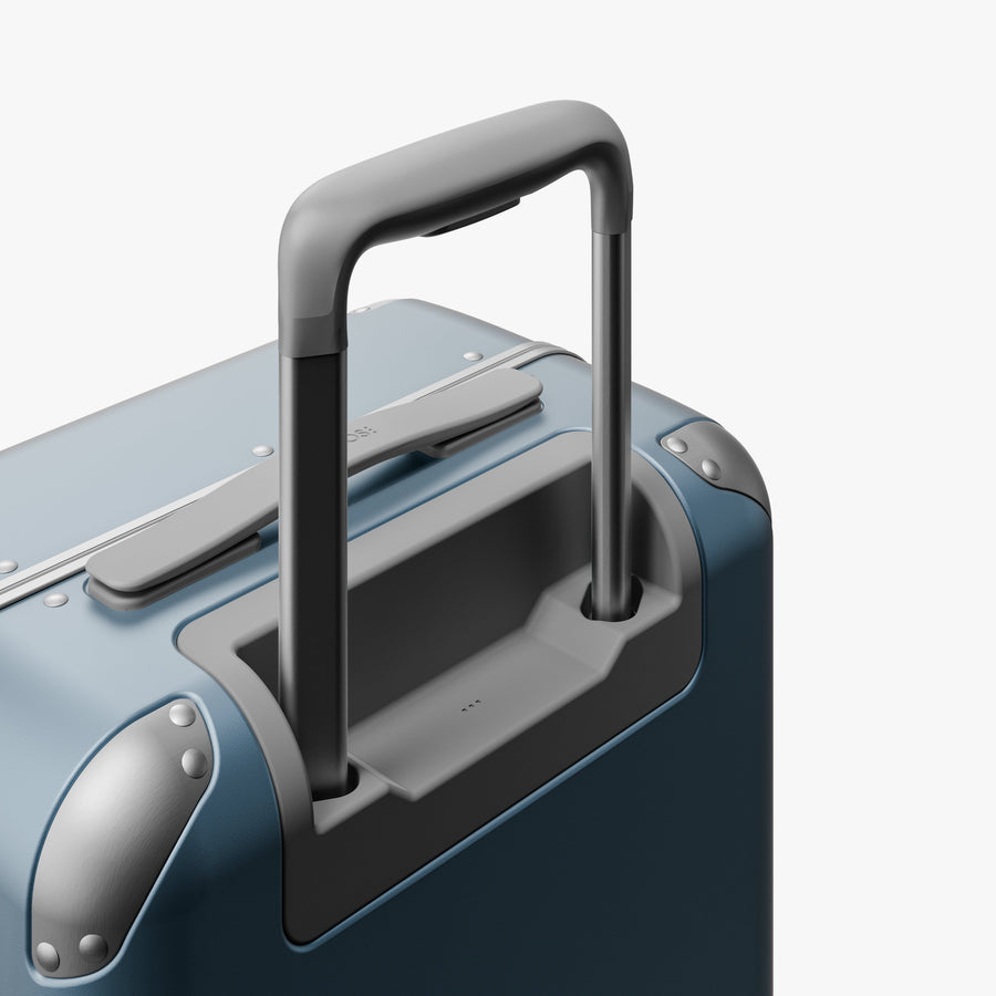 Elemental Blue | Extended luggage handle view of Hybrid Carry-On in Elemental Blue