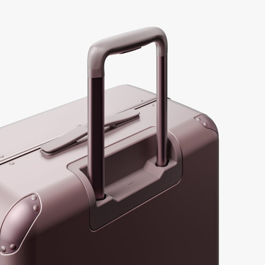 Orchid | Extended luggage handle view of Hybrid Check-In Medium in Orchid