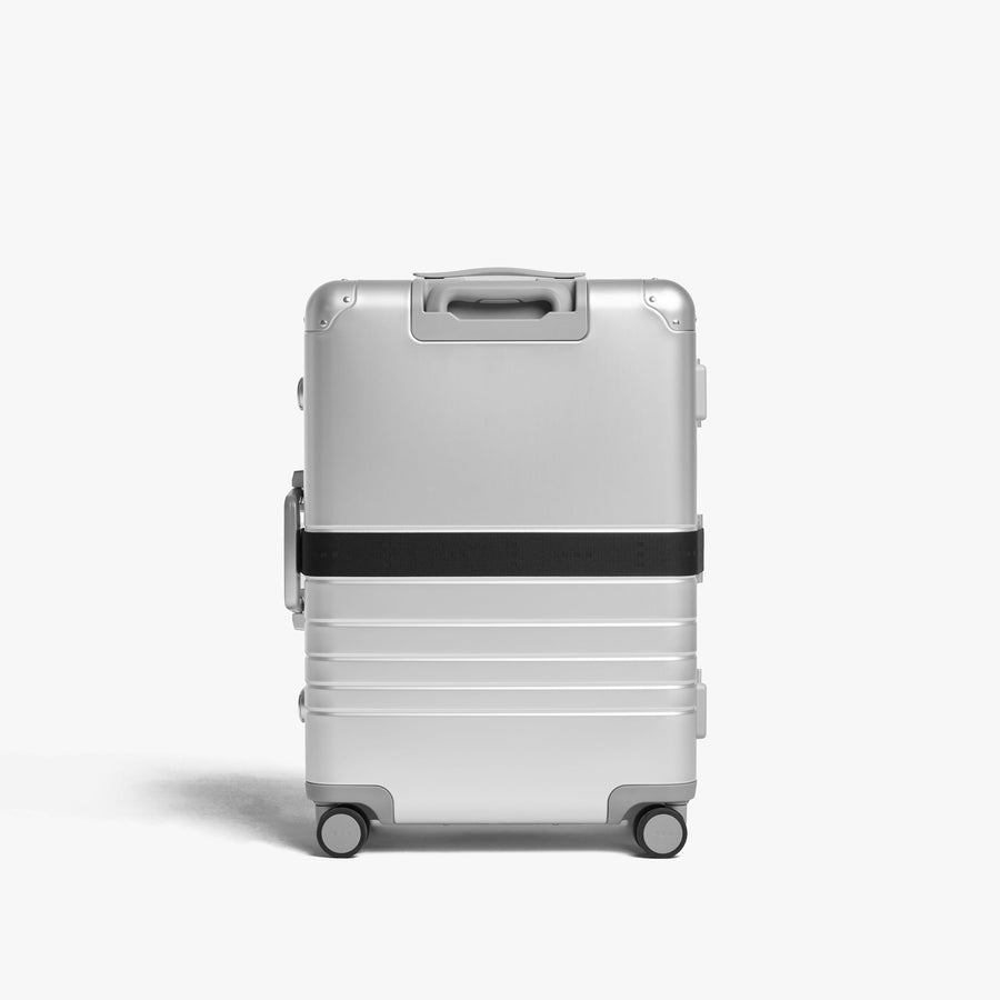Midnight Black | Front view of Aluminum suitcase with the Midnight Black Luggage Strap secured around it