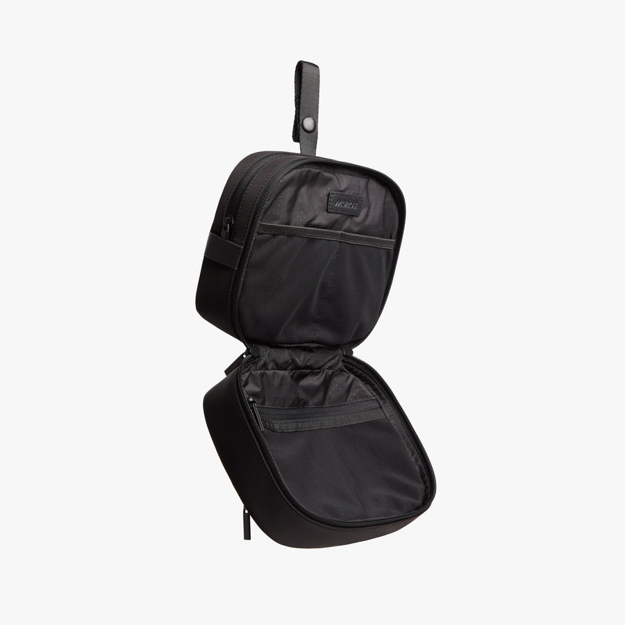Carbon Black | Open side view of Metro Hanging Toiletry Case in Carbon Black