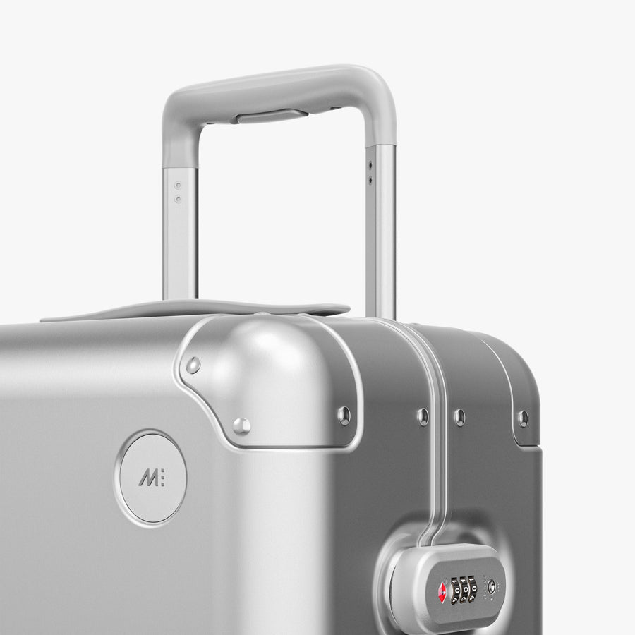 Aspen Silver | Luggage handle view of Aluminum Carry-On Plus in Aspen Silver