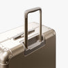Extended luggage handle view of Aluminum Check-In Large in Champagne Gold (thumbnail)