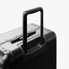 Extended luggage handle view of Aluminum Check-In Medium in Caviar Black (thumbnail)