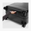 Bottom grab handle view of Aluminum Check-In Medium in Caviar Black (thumbnail)