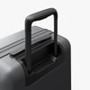Extended luggage handle view of Expandable Carry-On Pro in Storm Grey (thumbnail)
