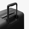 Extended luggage handle view of Expandable Check-In Medium in Midnight Black (thumbnail)