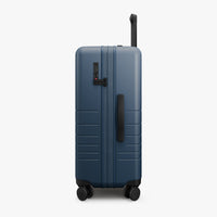 Side view of Expandable Check-In Medium in Ocean Blue (thumbnail)