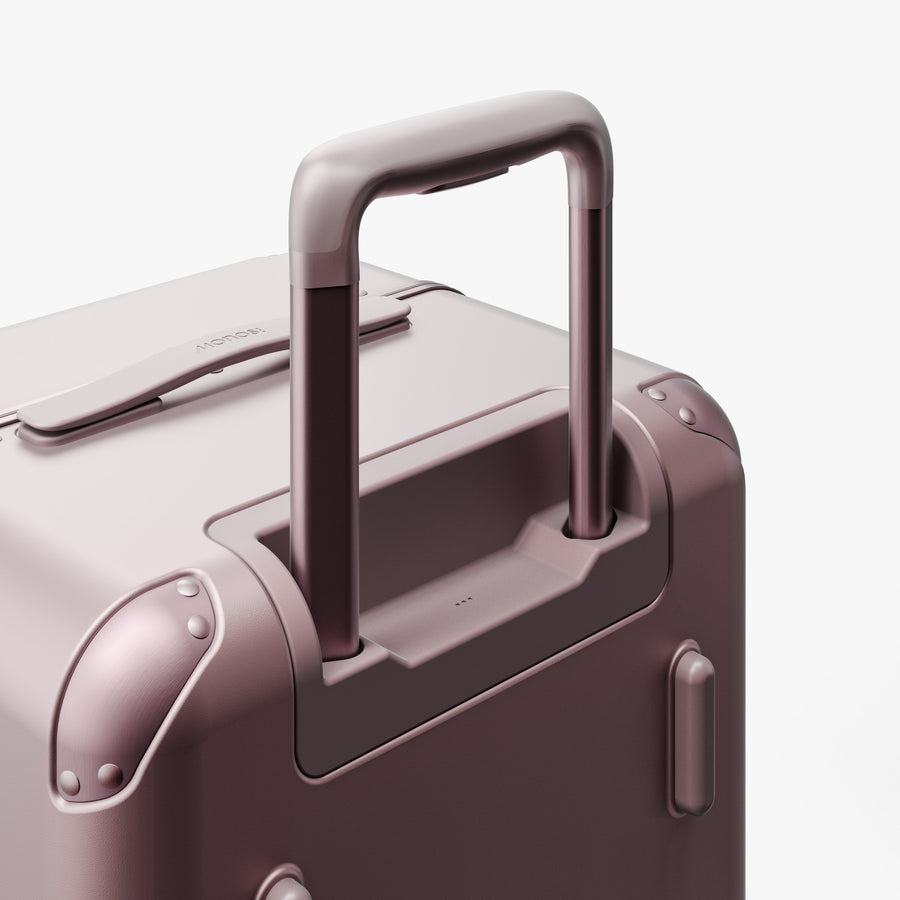 Orchid | Extended luggage handle view of Hybrid Trunk Medium in Orchid