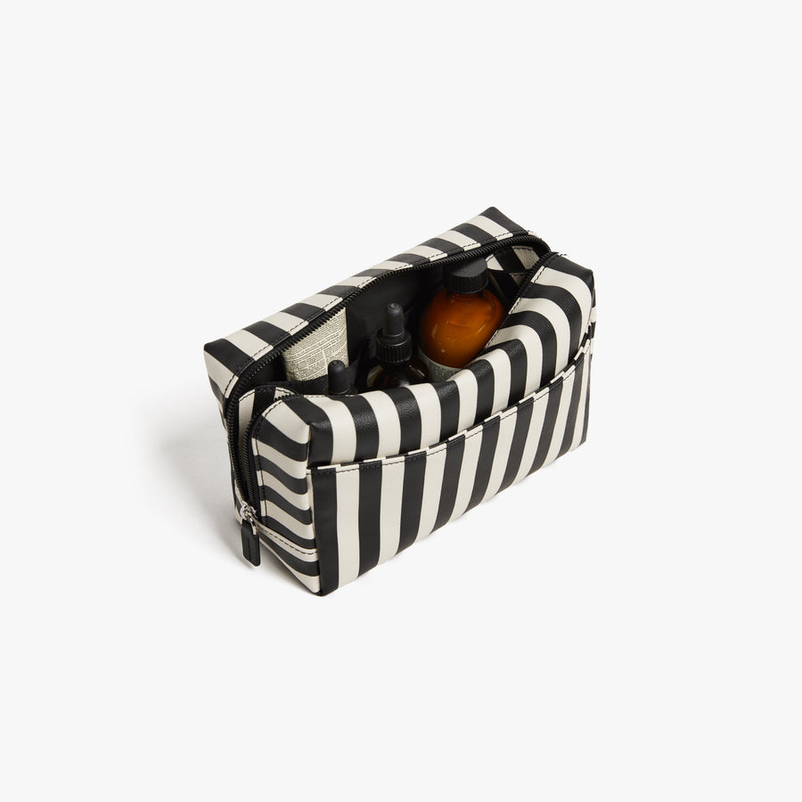 Large / Poplin Stripe Black | Back angled view of the opened large Metro Toiletry Case in Poplin Stripe Black, showing travel essentials stored inside