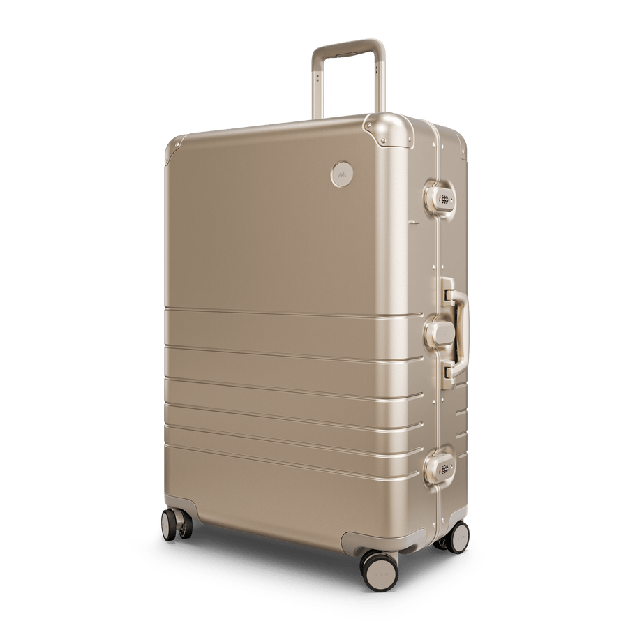 Champagne Gold Hover | Angle view of Aluminum Check-In Large in Champagne Gold