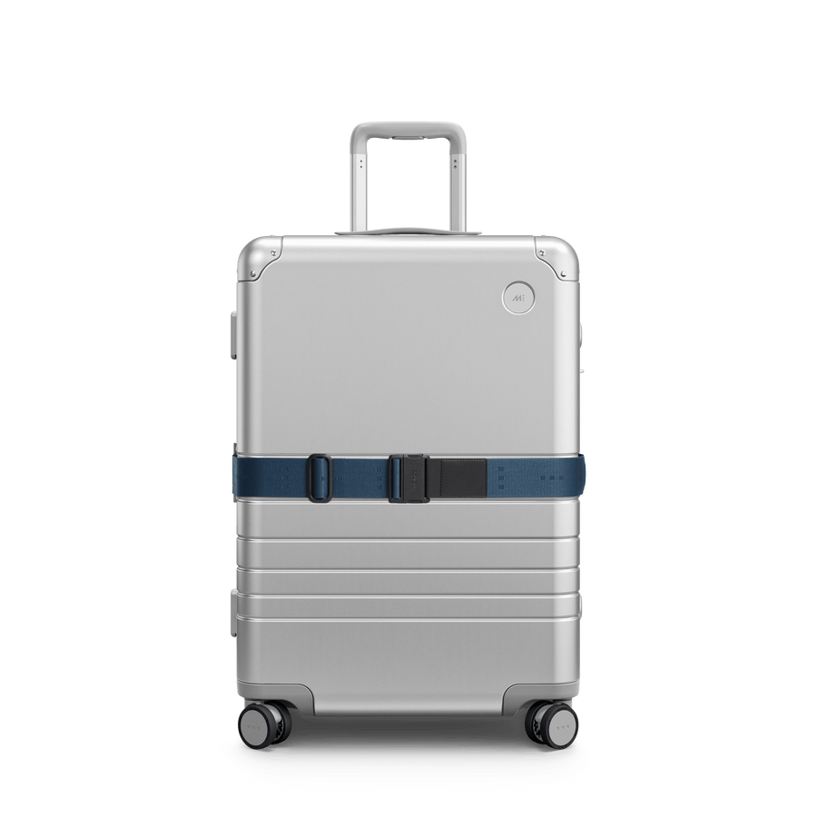 Ocean Blue Scaled | Front view of Aluminum suitcase with the Ocean Blue Luggage Strap secured around it