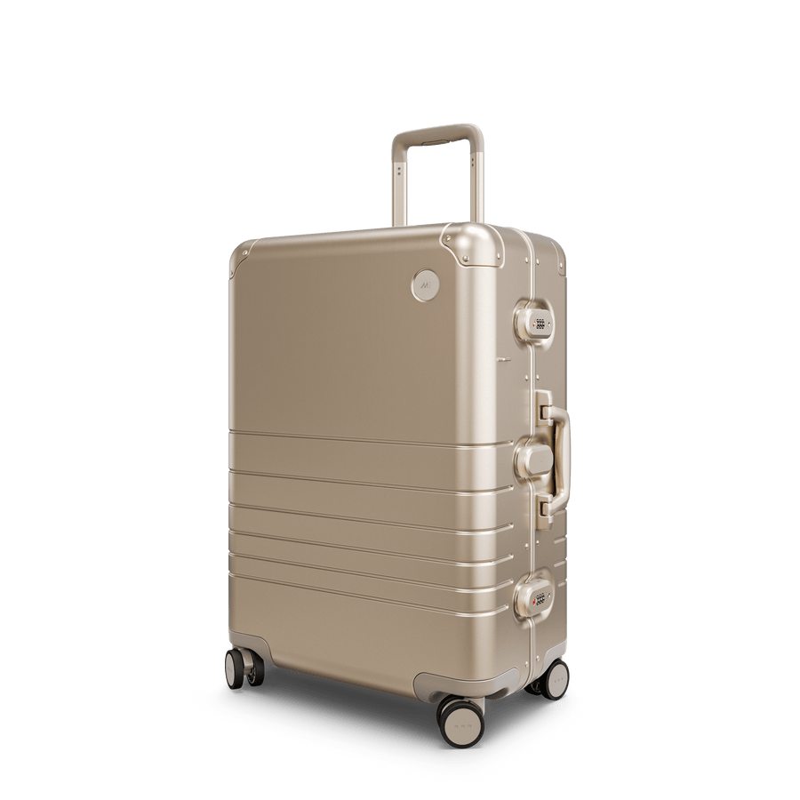 Champagne Gold Hover | Angle view of Aluminum Check-In Medium in Champagne Gold