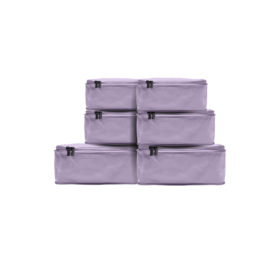Set of Six / Purple Icing Hidden | This is a photo of a set of six compressible packing cubes in Purple Icing