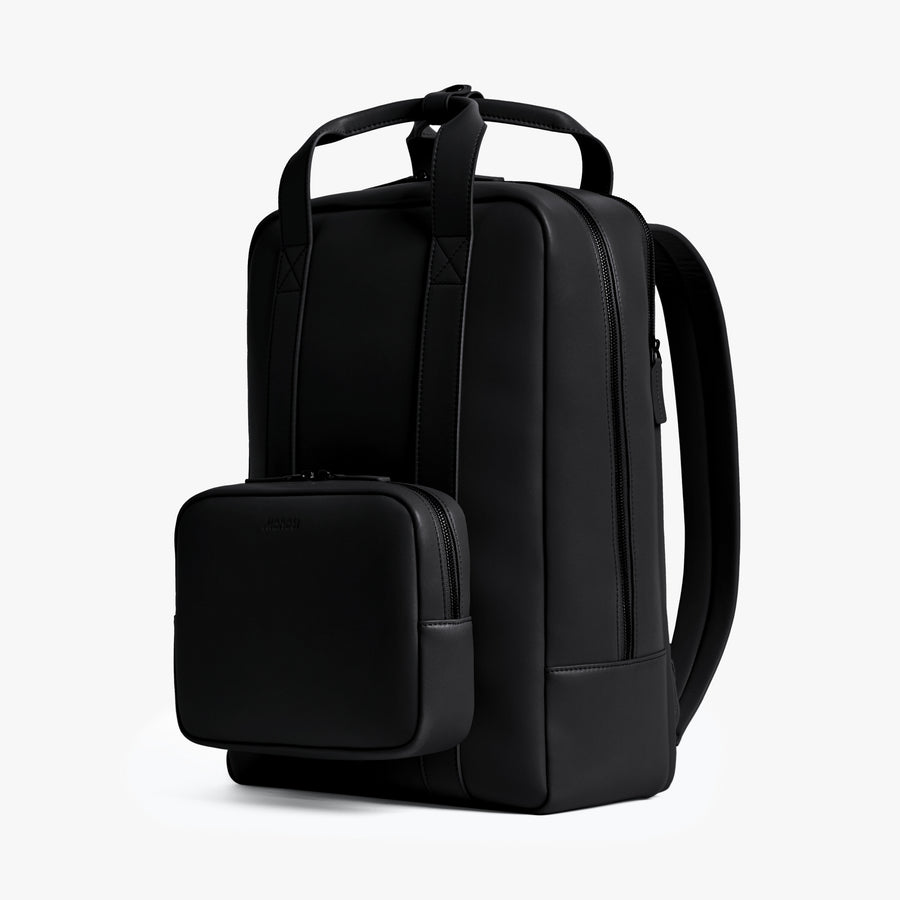 Carbon Black (Vegan Leather) | Angled view of Metro Backpack in Carbon Black