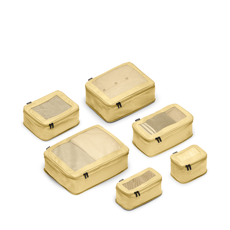 Set of Six / Banana Pudding Scaled | This is a photo of a set of six compressible packing cubes in Banana Pudding