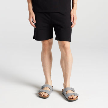 Front view of man in Kyoto Shorts in Black