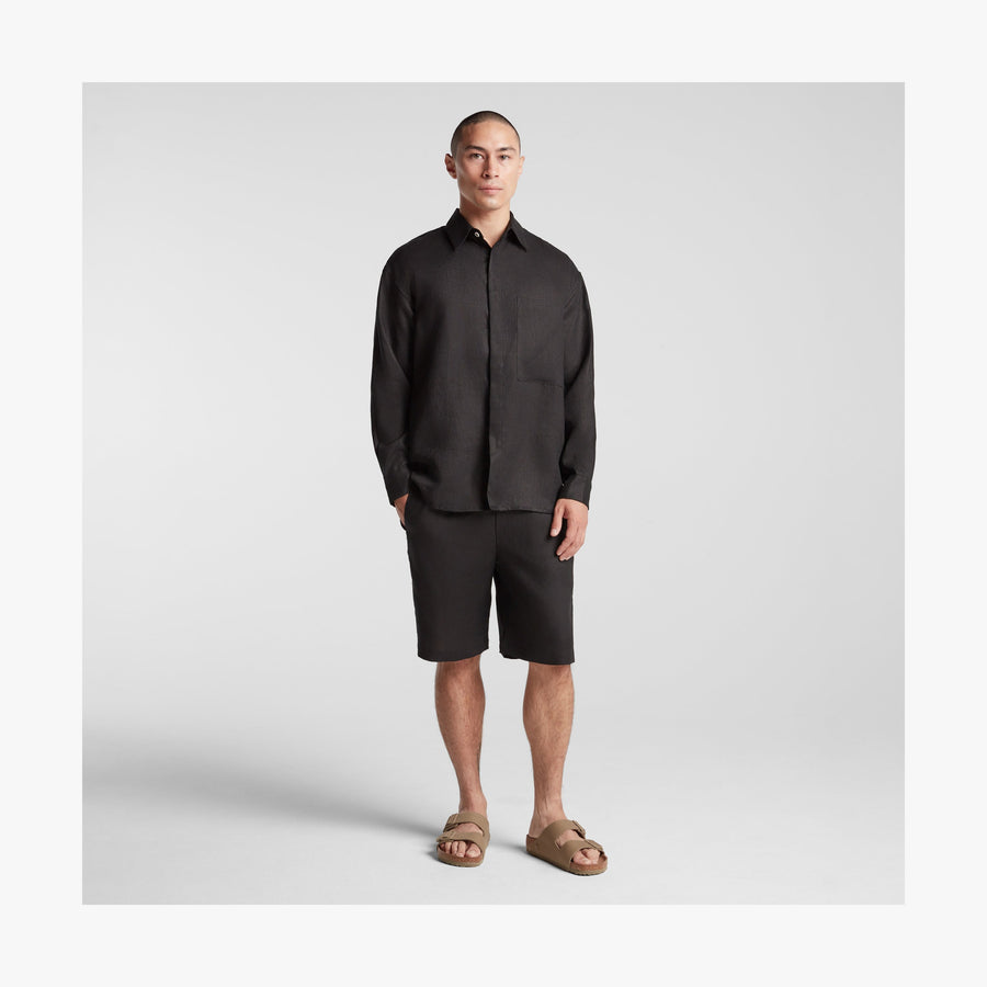 Black | Full body front view of man in Algarve Shirt  in Black