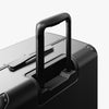 Extended luggage handle view of Hybrid Check-In Large in Obsidian (thumbnail)