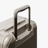 Extended luggage handle view of Hybrid Carry-On in Champagne (thumbnail)