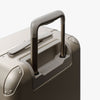 Extended luggage handle view of Hybrid Carry-On Plus in Champagne (thumbnail)