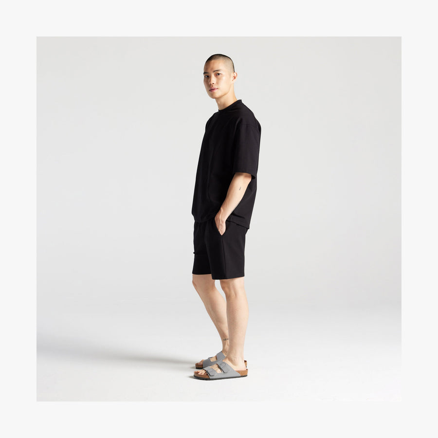 Black | Full body side view of man in Kyoto Shorts in Black