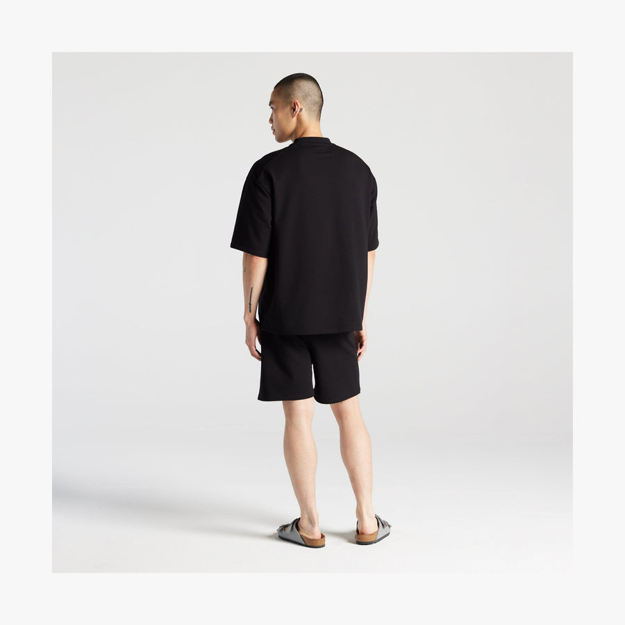 Black | Full body back view of man in Kyoto Shorts in Black