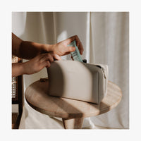 Lifestyle image showing the Metro Toiletry Case Large in Ivory (thumbnail)