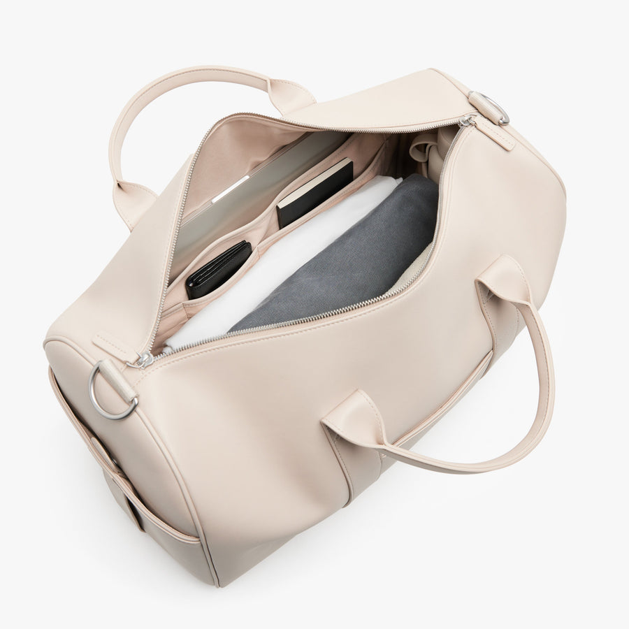 Ivory (Vegan Leather) | Angled view of Metro Carry-All Duffel in Ivory