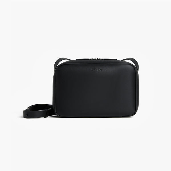 Carbon Black (Vegan Leather) | Front view of Metro Crossbody Carbon Black