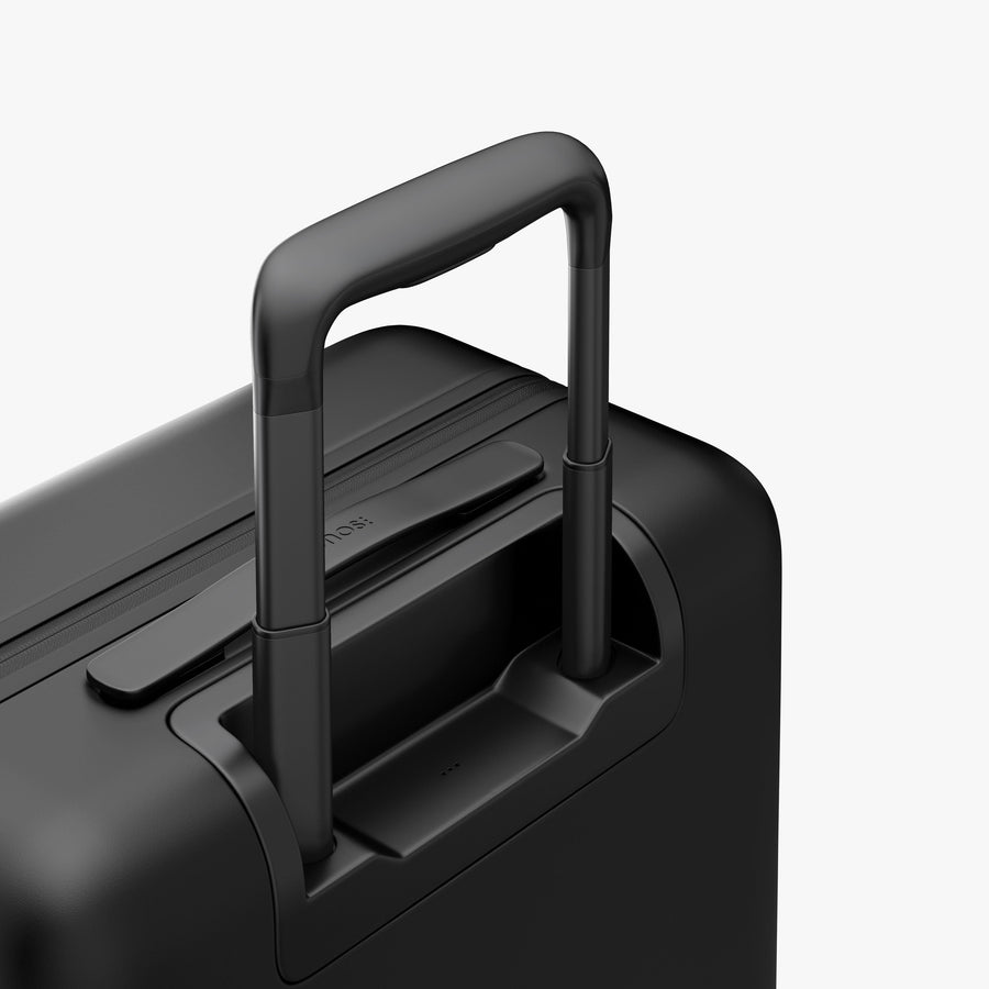 Midnight Black | Extended luggage handle view of Carry-On Pro in Midnight Black