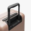 Extended luggage handle view of Carry-On in Rose Quartz (thumbnail)