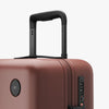 Luggage handle view of Carry-On Plus in Terracotta (thumbnail)