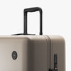 Luggage handle view of Check-In Large in Desert Taupe (thumbnail)