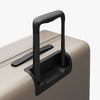 Extended luggage handle view of Check-In Large in Desert Taupe (thumbnail)