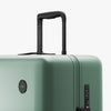 Luggage handle view of Check-In Large in Sage Green (thumbnail)