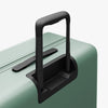 Extended luggage handle view of Check-In Large in Sage Green (thumbnail)