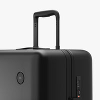 Luggage handle view of Check-In Large in Midnight Black (thumbnail)
