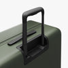 Extended luggage handle view of Check-In Large in Olive Green (thumbnail)