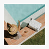 This is a photo of a Terrazzo Carry-On Plus beside a pool (thumbnail)