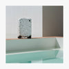 This is a photo of a Terrazzo Carry-On Plus by a pool (thumbnail)
