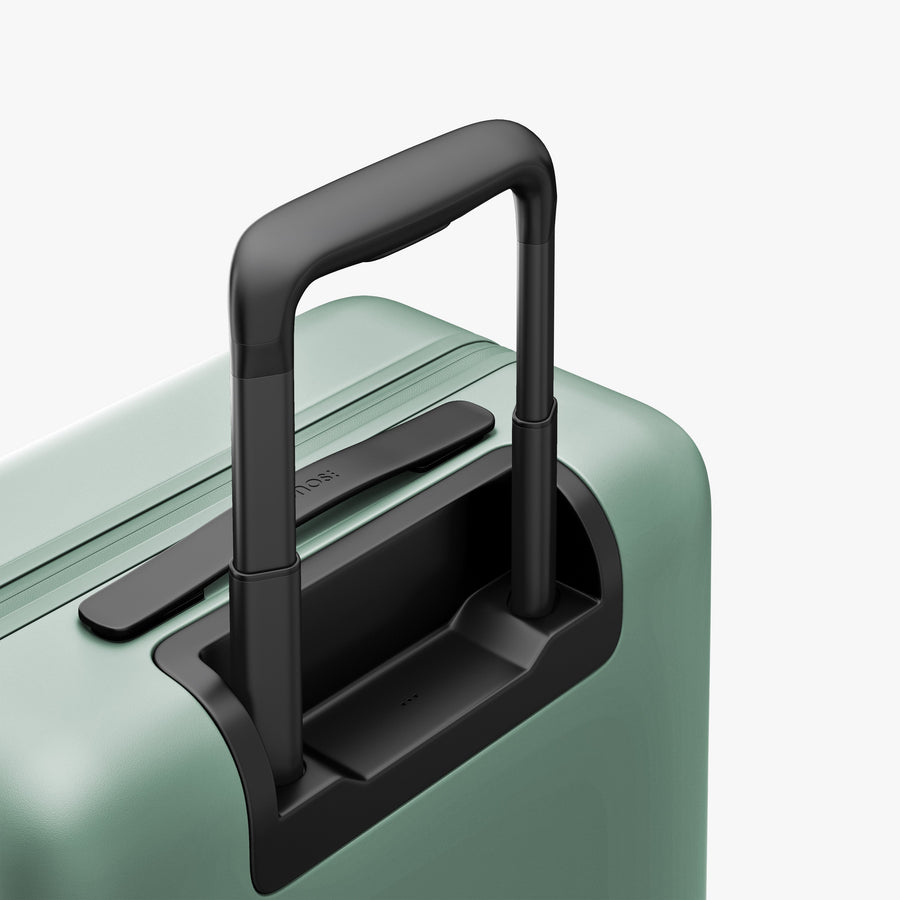 Sage Green | Extended luggage handle view of Carry-On in Sage Green
