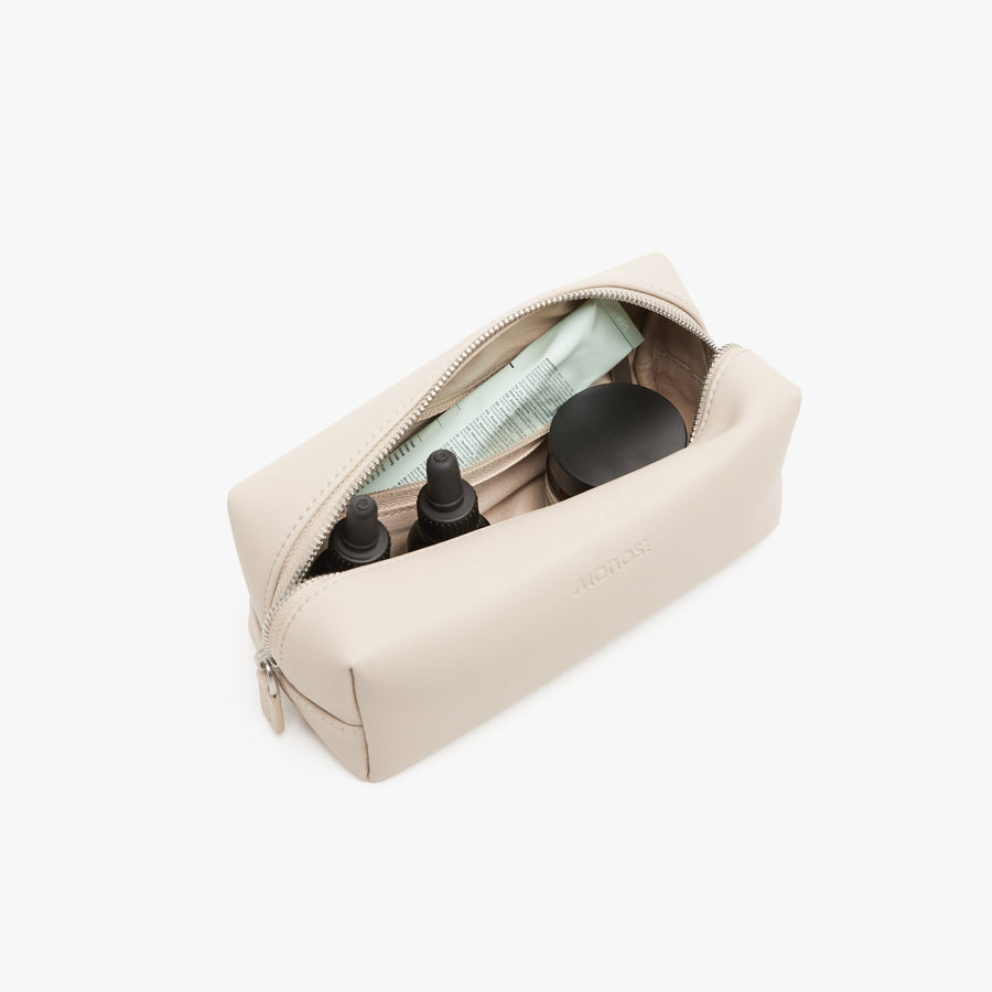 Small / Ivory | Interior front view of Metro Toiletry Case Small in Ivory