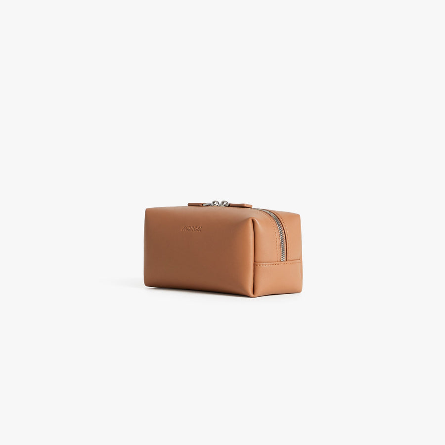 Small / Saddle Tan (Vegan Leather) | Angled view of Metro Toiletry Case Small in Saddle Tan