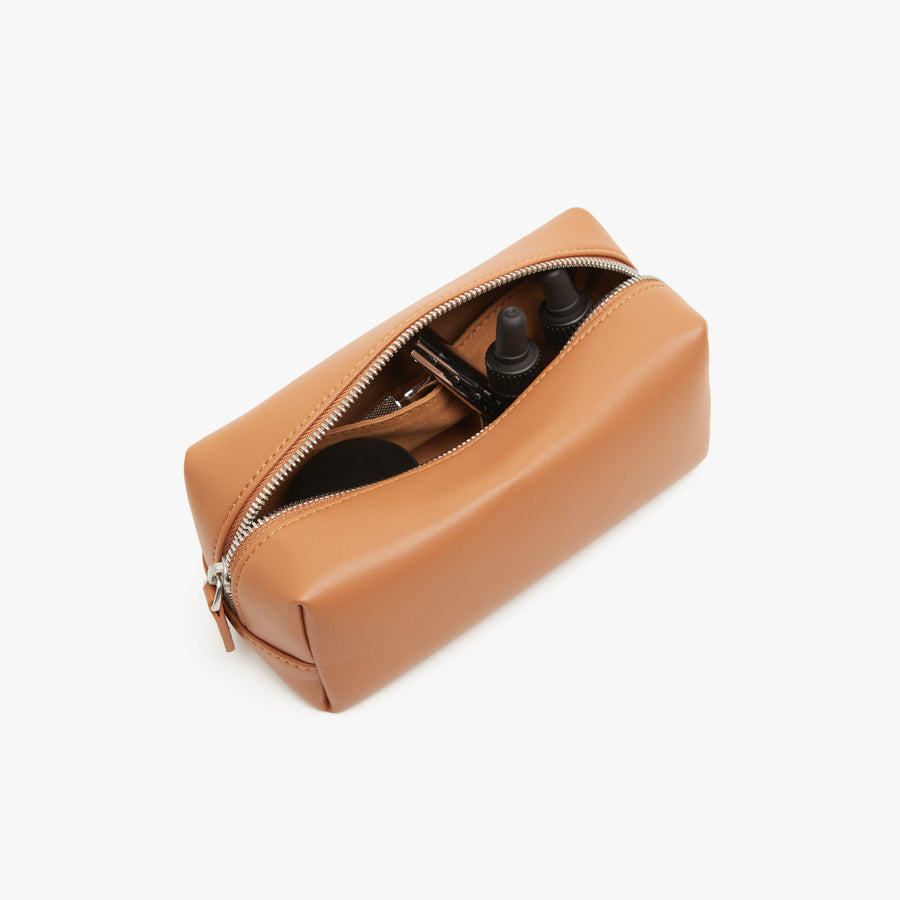 Small / Saddle Tan | Interior back view of Metro Toiletry Case Small in Saddle Tan